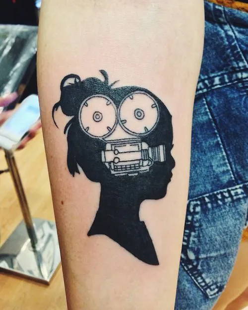 Black-Movie-Camera-In-Girl-Head-Tattoo-On-Forearm